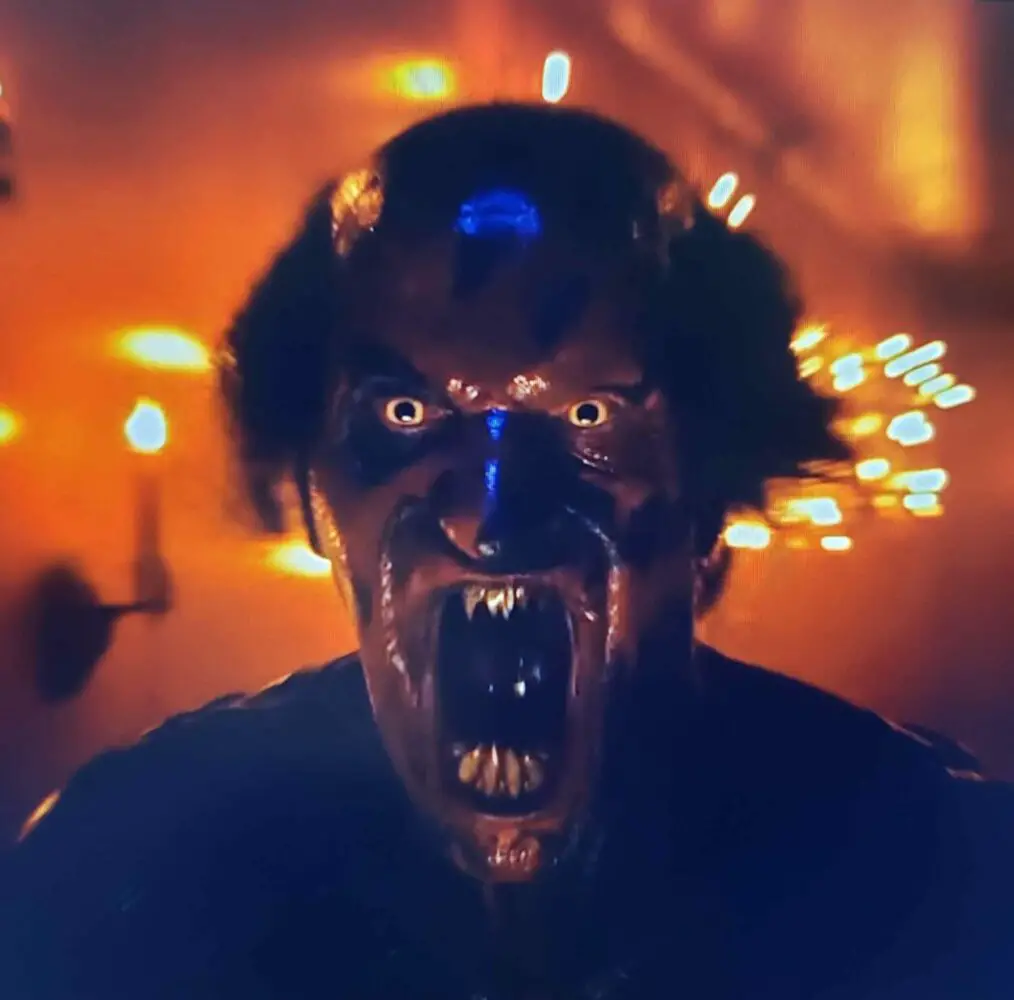 Joseph Bishara as the Lipstick-face Demon in Insidious: The Red Door (2023). Screen capture of Insidious: The Red Door from Sony Entertainment ads/trailers.
