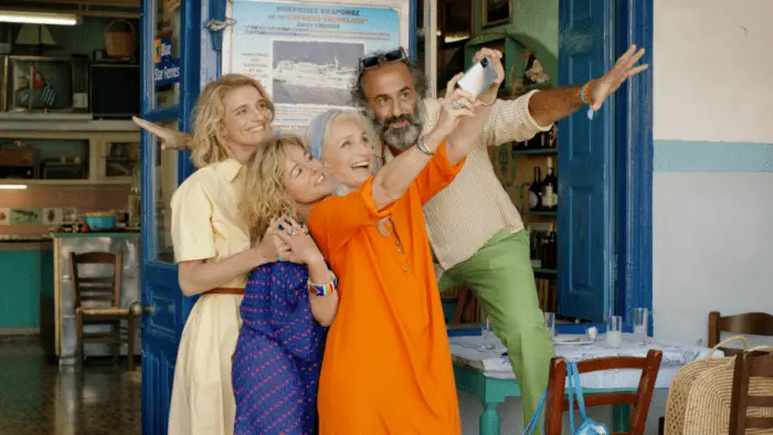 Left to right. Olivia Côte as Blandine, Laure Calamy as Magalie, Kristin Scott Thomas as Bijou and Panos Koronis as Dimitris in TWO TICKETS TO GREECE. Courtesy of Greenwich Entertainment.