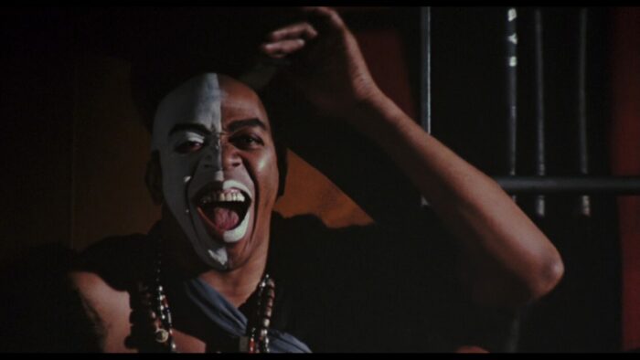 Geoffrey Holder as Baron Samedi laughs at the camera in Live and Let DIe.