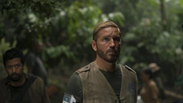 Jim Caviezel as Tim Ballard walking through a rainforest in Sound of Freedom.