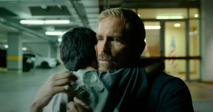 Jim Caviezel hugs a child in Sound of Freedom.