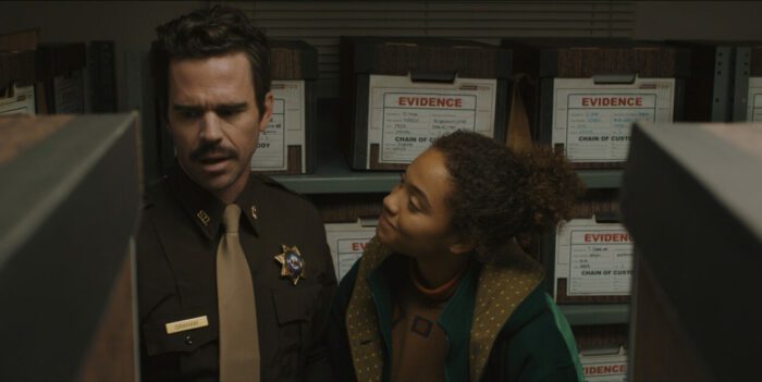 A girl turns to talk to a deputy in Susie Searches