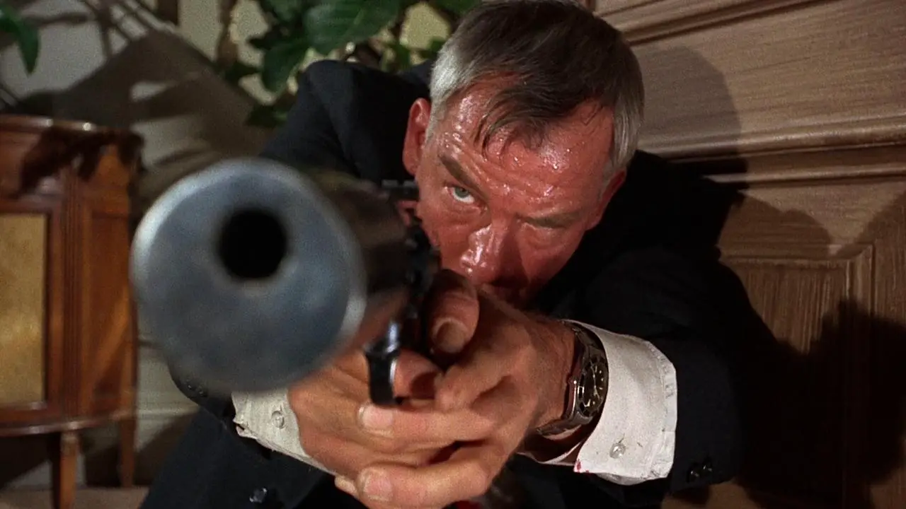 Charlie Storm (Lee Marvin) takes aim and prepares to fire in The Killers (1964).