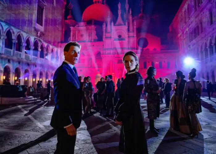 A man and woman stand outside a massive club party in Mission: Impossible - Dead Reckoning Part One