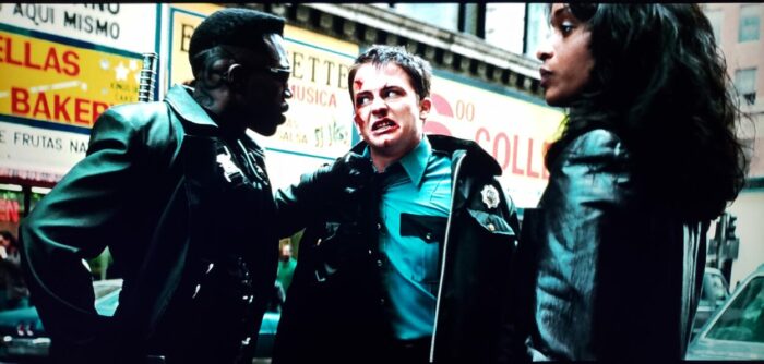 [L to R] Wesley Snipes, Kevin Patrick Walls, and N'Bushe Wright as Blade, Officer Krieger, and Dr. Karen Jenson in Blade (1998). Screen capture from the New Line Cinema film.