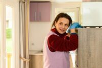 Juliette Binoche as Marianne, resting while cleaning an apartment in Between Two Worlds.
