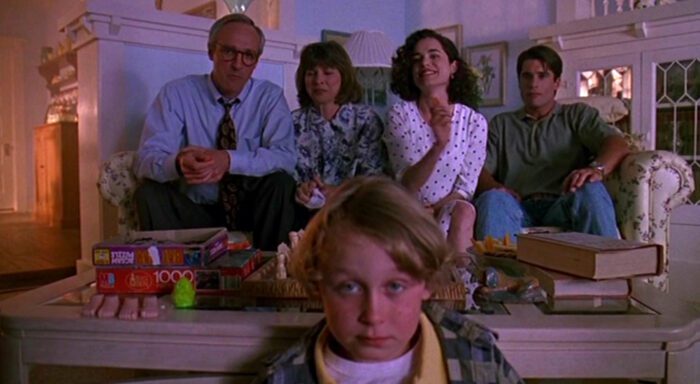 The entire Winslow family sits and looks forward.