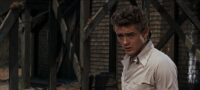 A young man looks towards his brother in East of Eden
