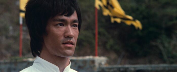Lee looks over at his opponent in Enter the Dragon