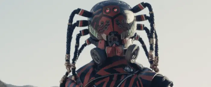 Spider-Aug (Nao Ōmori) in Shin Kamen Rider with 8 dreadlocks taking on the appearance of a spider's legs
