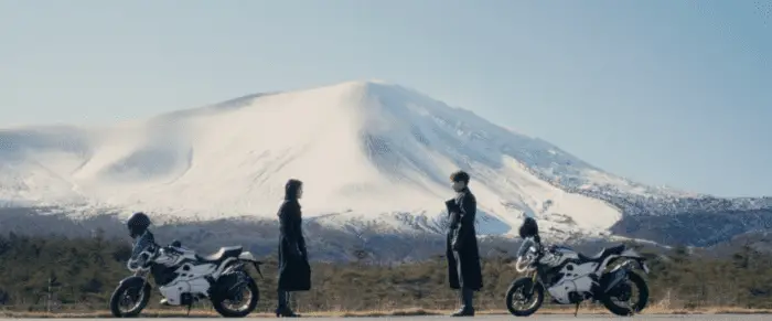 Takeshi Hongo (Sosuke Ikematsu) and Hayato Ichimonji (Tasuku Emoto) in front of a mountain, talking about what they're going to do next, as two Kamen Riders.