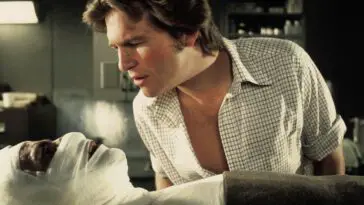 Jeff Bridges as Nick inspects a person with a bandaged head.