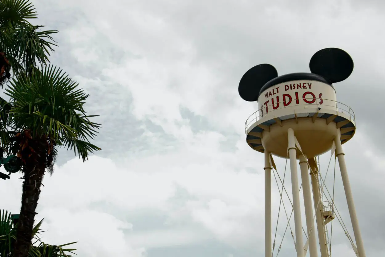 The water tower of Walt Disney Studios appears beneath a cloudy sky.