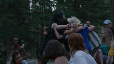 A group of campers embrace