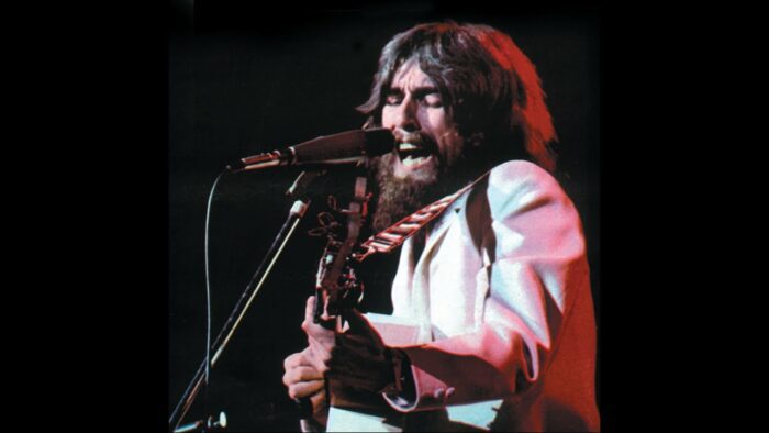 George Harrison performs in The Concert for Bangladesh.