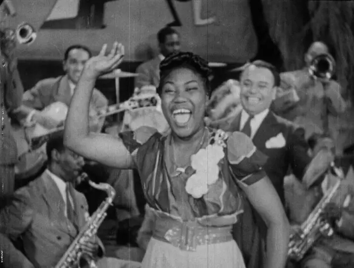 Lucky Millinder and His Orchestra featuring Sister Tharpe perform "Four or Five Times" (1941). Photo: courtesy Kino Classics.