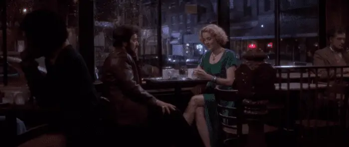 A man and woman enjoy a late cup of coffee at a diner in Carlito's Way