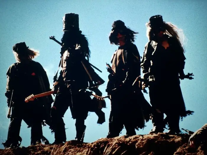 Stephane Gauger, Ngoc Lam, Collin Olympius, Cooper Donaldson, Noel Falcon, and Jason Dunn as Death and his archers in Six-String Samurai (1998). Screen capture off Vinegar Syndrome blu-ray release.