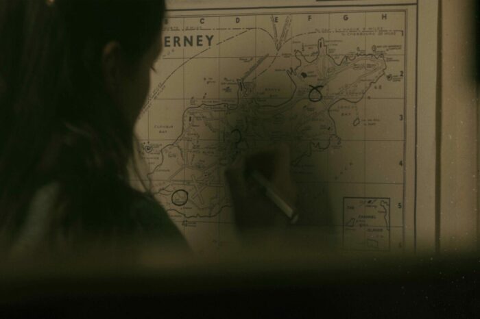 Agnes looks at a map.