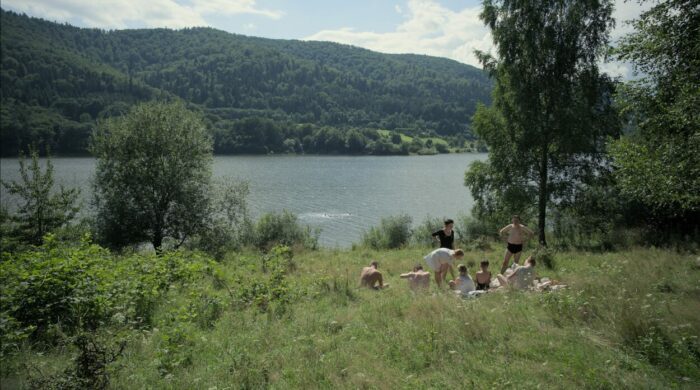 An idyllic picnic happens near a lake