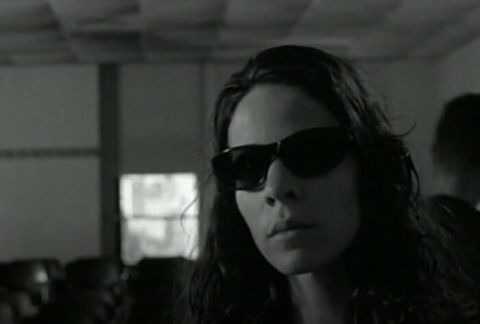Lili Taylor wearing glasses in film The Addiction 