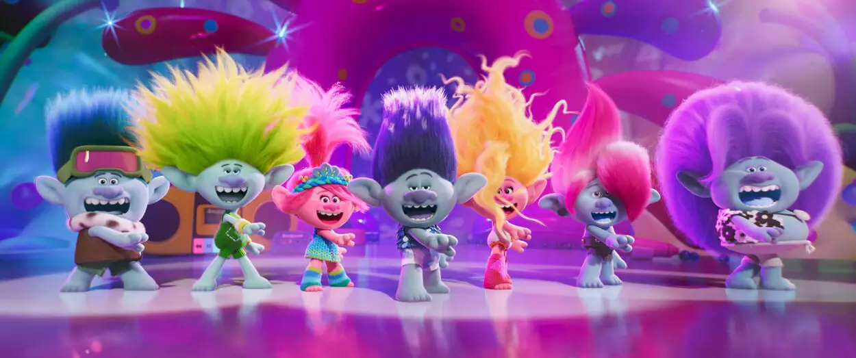 Seven trolls dance together for a big song in Trolls Band Together