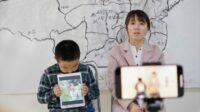 Zijuan Chen (R) and her son Tutu make a video appealing for the release of her husband, arrested civil rights lawyer Chang Weiping.