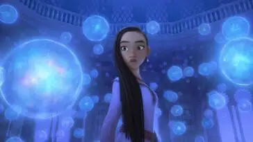 A girl stands surrounded by glowing orbs in Wish.