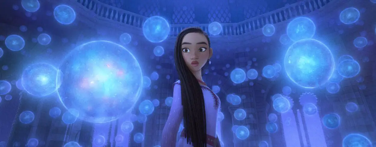 A girl stands surrounded by glowing orbs in Wish.