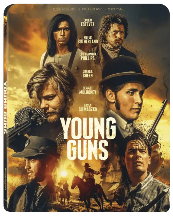 Poster of Young Guns featuring its starts Eilia Esttevez, Charlie Sheen, Kiefer Sutherland, Casaey Seimaskzko, Lou Diamond Phillips, and Dermot Mulroney.
