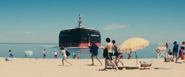 The Sanford family runs from an oil tanker headed straight for them as they sunbathe ashore. 