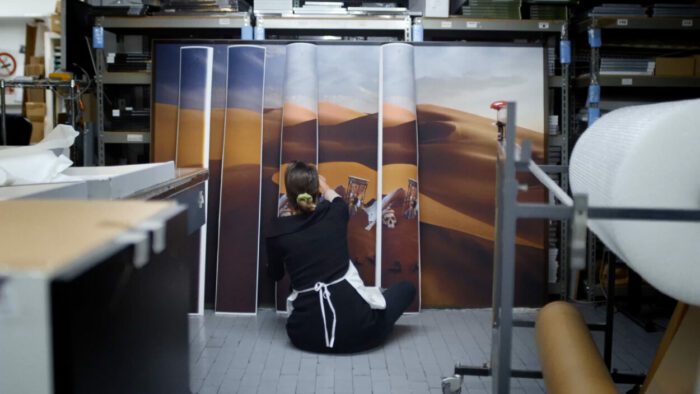Anne De Carbucci assembles one of her photographic prints of an installation for exhibition.