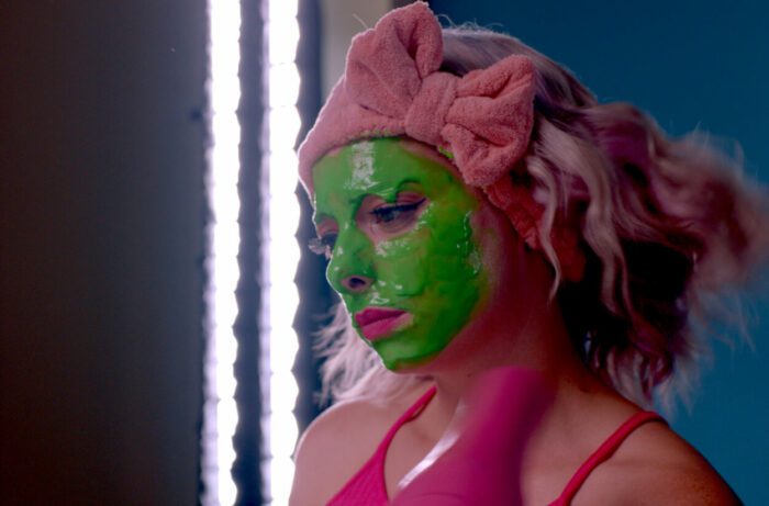 Tori wears a green slime mask for a YouTube video.