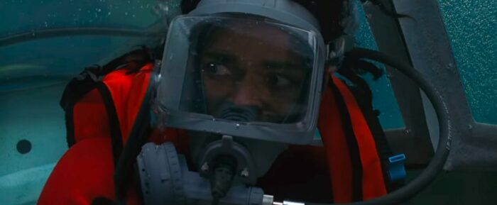 Mario Van Peebles as Jake in Jaws: The Revenge (1987). Screen capture off of Netflix. Jake in scuba gear in a submersible