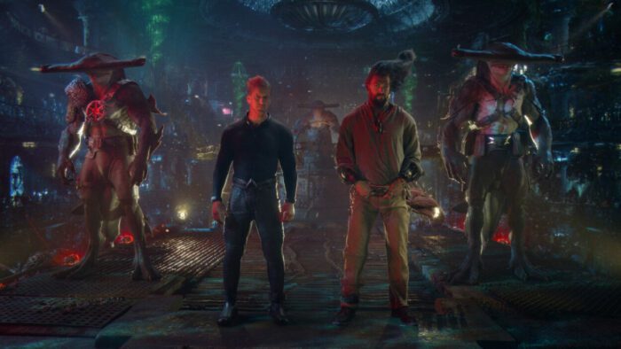 (L-r Center) PATRICK WILSON and JASON MOMOA as Aquaman in Warner Bros. Pictures’ action adventure “Aquaman and the Lost Kingdom,” a Warner Bros. Pictures release. Aquaman and his brother Orm stand in chains flanked by bipedal hammerhead shark guards in a grim pirate grotto.