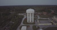 A wide shot of Flint's water tower.
