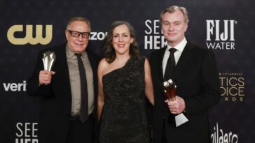 Three producers hold their Critics Choice Awards