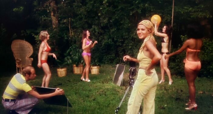 Marki Bey and several uncredited extras as Diana "Sugar" Hill and bikini models in Sugar Hill (1974). Screen capture off Amazon. An American International Picture/MGM. Diana "Sugar" Hill photographing several bikini models while an assistant catches more light.