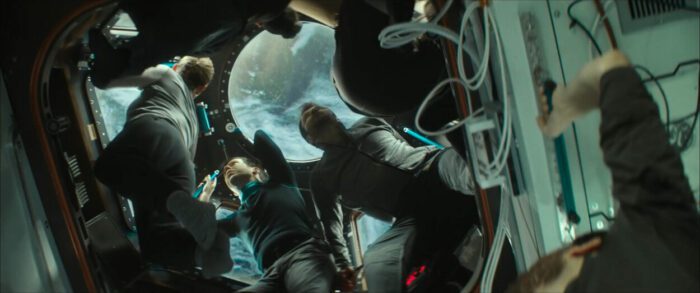 Crew members float in zero gravity on the I.S.S.
