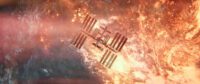 The International Space Station floats above a flaming sky in I.S.S.