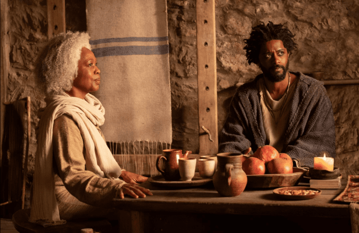 The Book of Clarence: l-r Alfre Woodard as Virgin Mary and LaKeith Stanfield as Clarence sitting at a table together