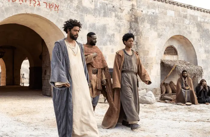 The Book of Clarence: l-r LaKeith Stanfield as Clarence, Omar Sy as Barabbas, RJ Cylar as Elijah walking through town