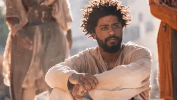 The Book of Clarence: LaKeith Stanfield as Clarence seated and looking to the right