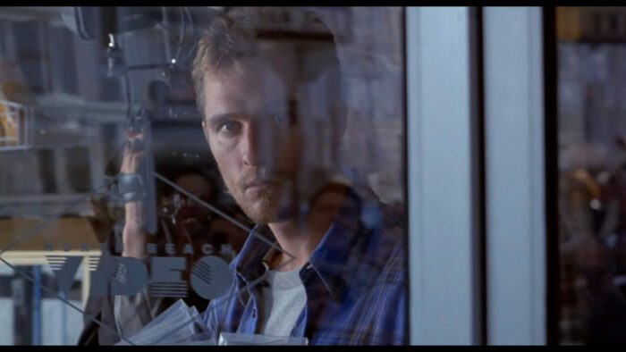 Ed looks out the window at something in EDtv.