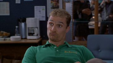 Ed makes a funny face while wearing a green polo shirt in EDtv