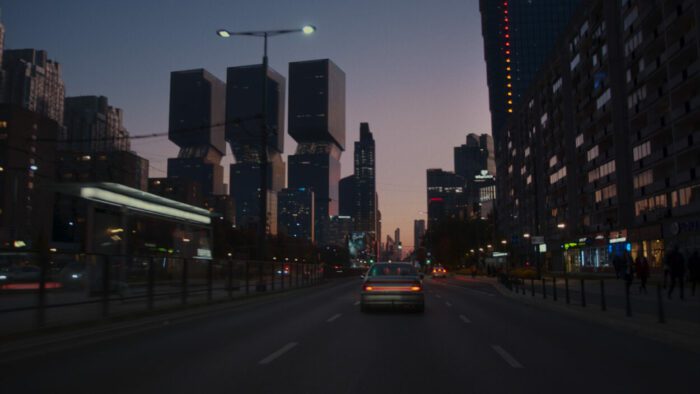 A futuristic cityscape is seen from a highway in Restore Point.