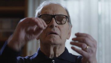 Ennio Morricone conducts, alone in his office, in Ennio.