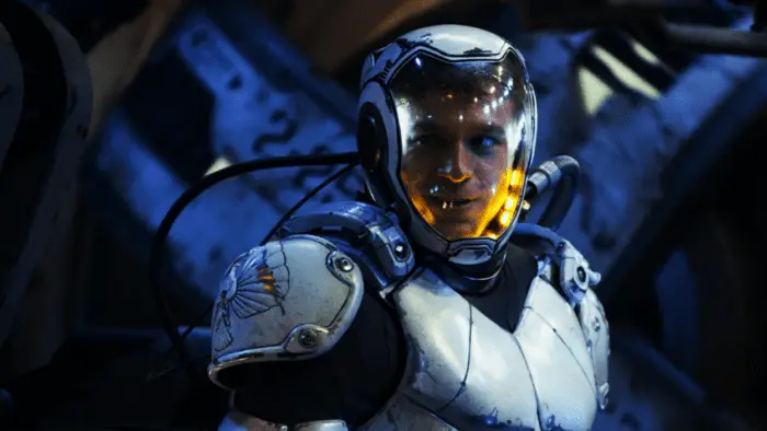 Raleigh (Charlie Hunnam) in the opening of Pacific Rim, dressed in a white plated suit to copilot his jaeger. 