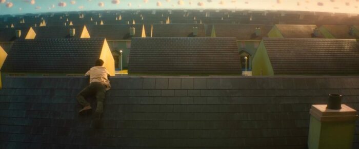 Tom climbs on a roof and discovers that the entire neighborhood is full of identical houses. 