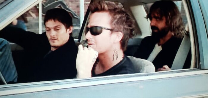 Norman Reedus, Sean Patrick Flannery, and David Della Rocco as Murphy, Connor, and Rocco in The Boondock Saints (1999). Screen capture off of DVD. Franchise Pictures. The three vigilantes sitting in a car plotting their next move.
